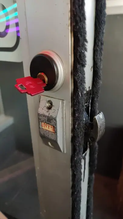 Hook bolt lock on an aluminum storefront door