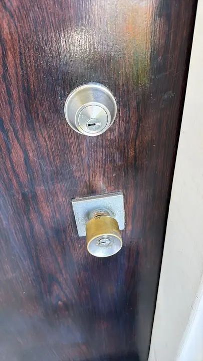 Deadbolt and knob on a wood door